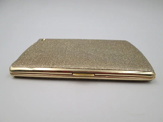 Cigarette case with petrol lighter. Gold plated metal. Grainy texture front. Box. 1960's