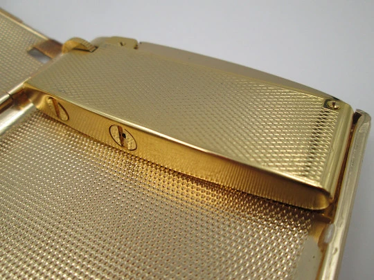 Cigarette case with petrol lighter. Gold plated metal. Grainy texture front. Box. 1960's