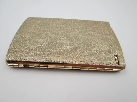 Cigarette case with petrol lighter. Gold plated metal. Grainy texture front. Box. 1960's