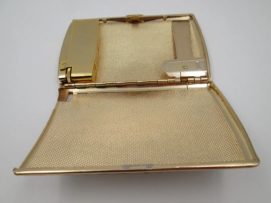 Cigarette case with petrol lighter. Gold plated metal. Grainy texture front. Box. 1960's