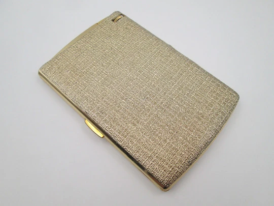 Cigarette case with petrol lighter. Gold plated metal. Grainy texture front. Box. 1960's