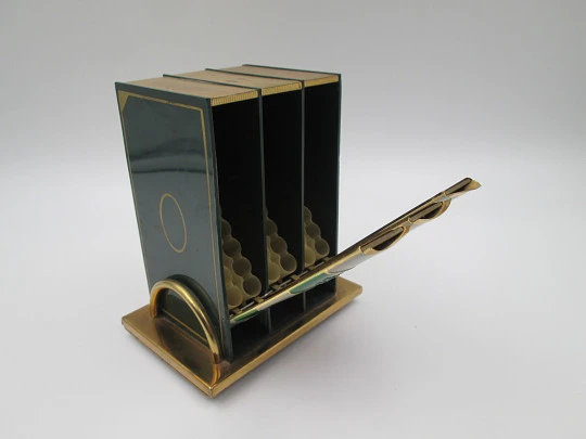 Cigarette dispenser book with stand. Lacquer brass. Three holders (30 pcs). Italy. 1950's