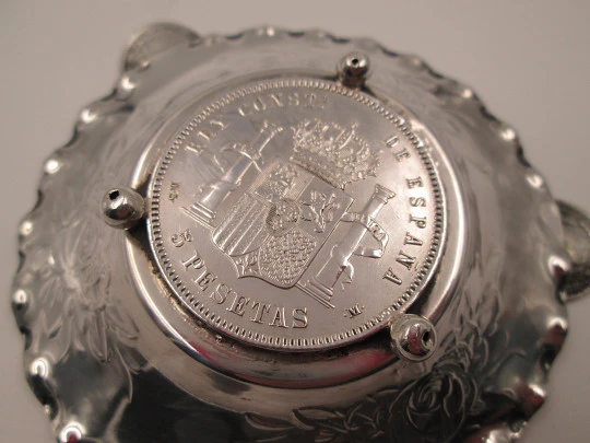 Circular ashtray, Alfonso XII coins and floral motifs. Sterling silver. 1970's