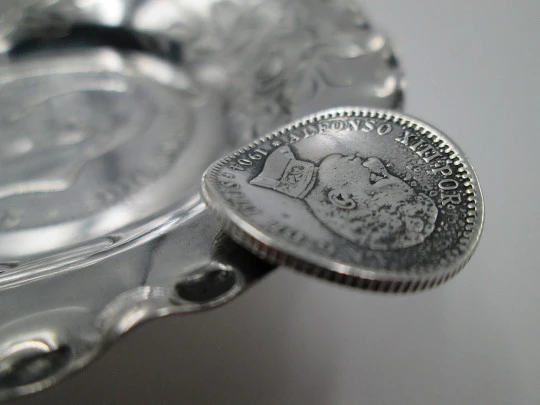 Circular ashtray, Alfonso XII coins and floral motifs. Sterling silver. 1970's