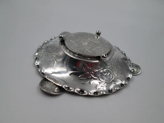 Circular ashtray, Alfonso XII coins and floral motifs. Sterling silver. 1970's