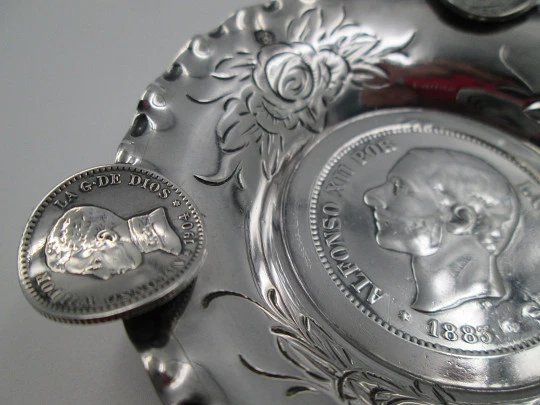 Circular ashtray, Alfonso XII coins and floral motifs. Sterling silver. 1970's