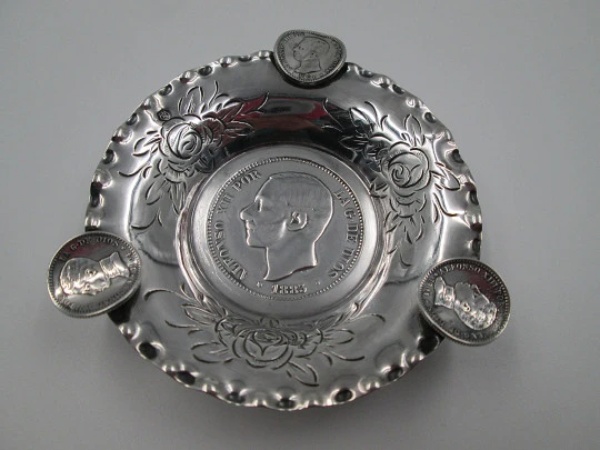 Circular ashtray, Alfonso XII coins and floral motifs. Sterling silver. 1970's