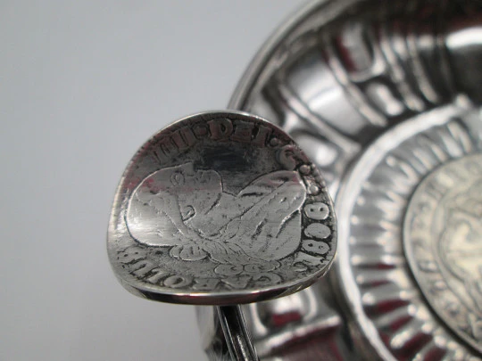 Circular ashtray, Carlos IV coins and ribbed motifs. Sterling silver. 1970's