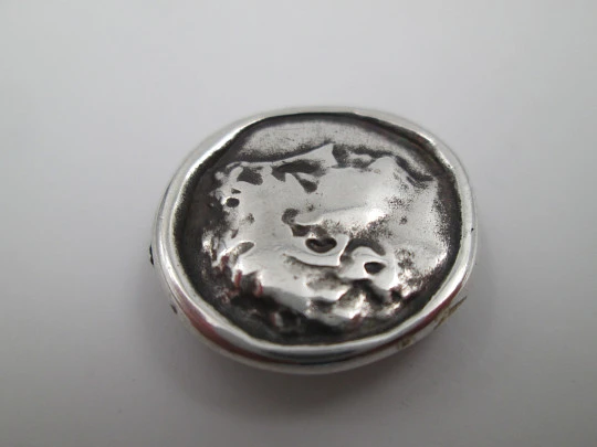 Circular pendant for ribbon. Sterling silver. Greek bust relief. Europe. 1930's