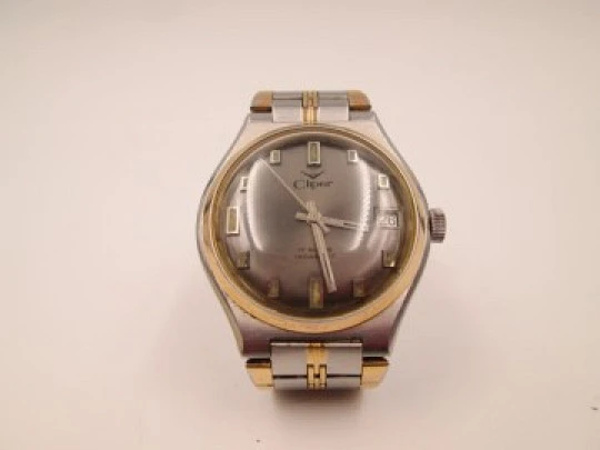 Cliper. Stainless steel. Gold plated bezel. Calendar. Manual wind. Bracelet. 1960's