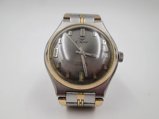 Cliper. Stainless steel. Gold plated bezel. Calendar. Manual wind. Bracelet. 1960's