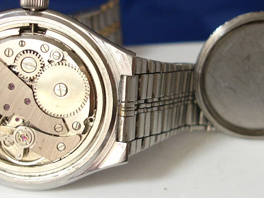 Cliper. Stainless steel. Gold plated bezel. Calendar. Manual wind. Bracelet. 1960's