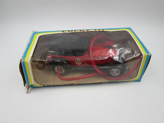 Coche policía Juguetes La Paz (Ibi). Plástico colores. Resorte y volante. Caja. 1970