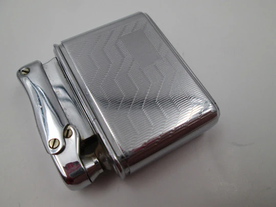 Colibri MonoGas pocket lighter. Silver plated. Geometric pattern. West Germany. 1950's