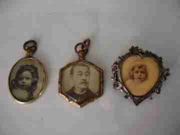 Collection of three antique photo frame pendants. Gold and silver metal. 1910's