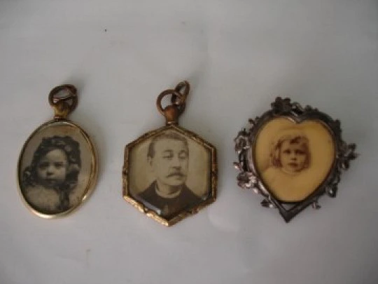 Collection of three antique photo frame pendants. Gold and silver metal. 1910's