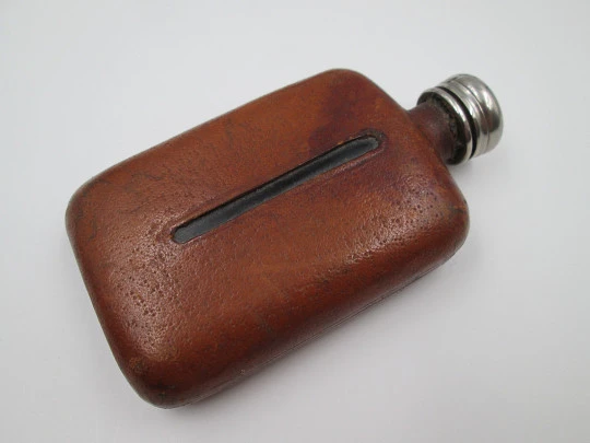 Collection three men's hip flasks. Stainless steel and leather. 1980's