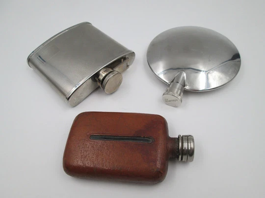 Collection three men's hip flasks. Stainless steel and leather. 1980's