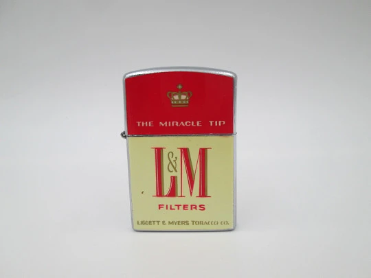 Continental petrol pocket lighter. LM cigarettes. Chromed metal. Box & instructions