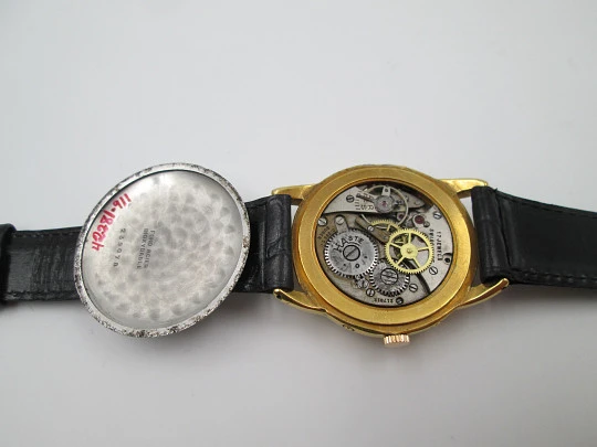 Coppel. Triple calendar & Moon phase. Steel and gold plated. Manual wind