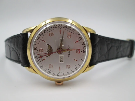 Coppel. Triple calendar & Moon phase. Steel and gold plated. Manual wind