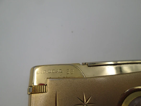 Cordial 33 butane lighter with Fero mechanical watch. Gold plated netal. 1960's. Swiss