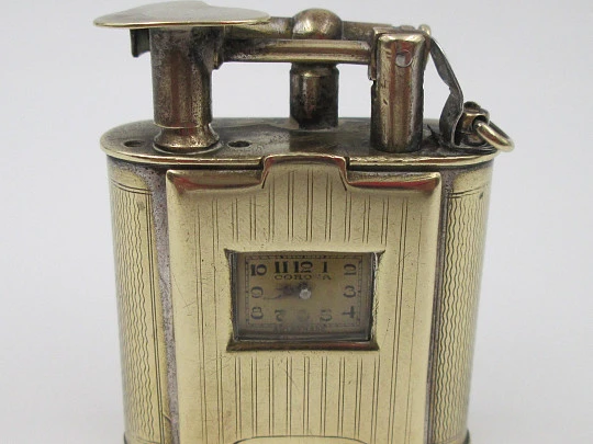 Corona petrol lighter with Atlantic wind-up watch. Golden plated. Germany / Swiss. 1940's Corona petrol lighter with Atlantic wind-up watch. Golden plated. Germany / Swiss. 1940's