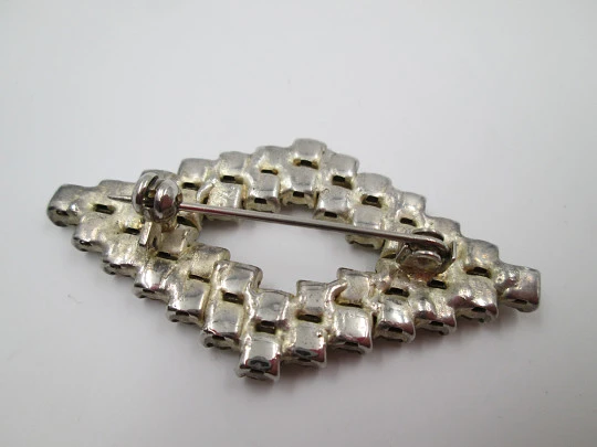 Costume jewelry brooch. Silver metal & rhinestones. Rhombus shape. 1960's