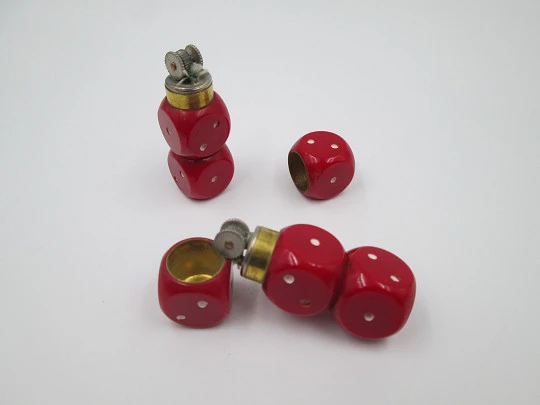 Couple dice lighters. Red plastic and golden metal. Germany. 1970