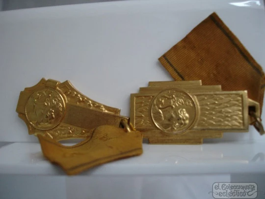 Couple medals. Golden metal. 1950's. Awards music. Women