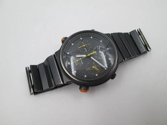 Cronógrafo cuarzo Seiko Sport 100. Metal pavonado negro y acero. Brazalete. 1980