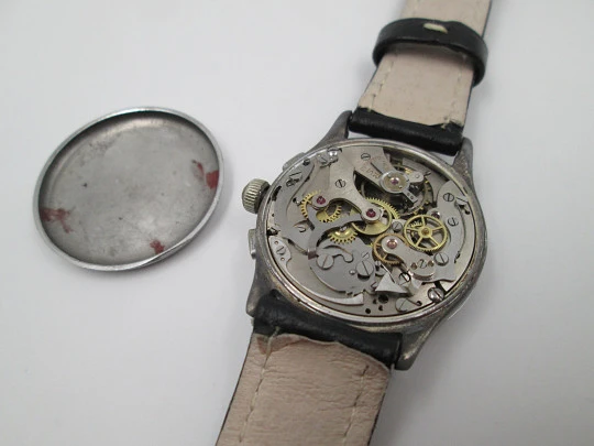 Cronógrafo suizo. Acero inoxidable y metal. Cuerda manual. Dial negro. 1940 Cronógrafo suizo. Acero inoxidable y metal. Cuerda manual. Dial negro. 1940