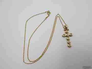Cross pendant with chain. 18K yellow gold and seven diamonds