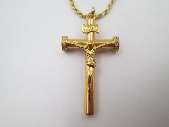 Crucifix pendant with braided cord. Golden sterling silver & white gems. 1980's. Europe
