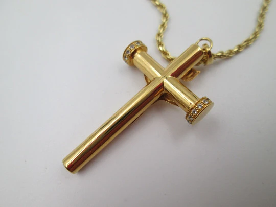 Crucifix pendant with braided cord. Golden sterling silver & white gems. 1980's. Europe