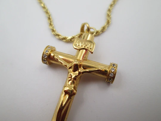 Crucifix pendant with braided cord. Golden sterling silver & white gems. 1980's. Europe
