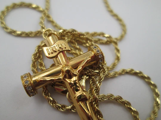 Crucifix pendant with braided cord. Golden sterling silver & white gems. 1980's. Europe