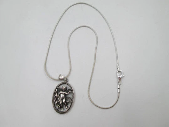 Cupid openwork oval pendant with cord. 925 sterling silver. Carabiner clasp. 1980's. Europe
