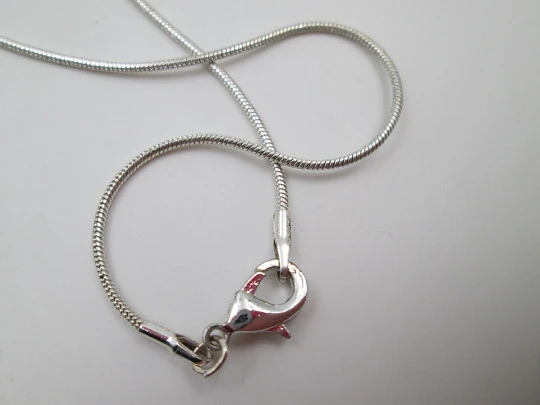 Cupid openwork oval pendant with cord. 925 sterling silver. Carabiner clasp. 1980's. Europe