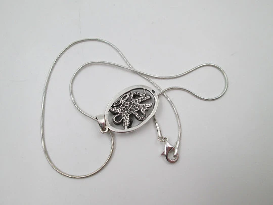 Cupid openwork oval pendant with cord. 925 sterling silver. Carabiner clasp. 1980's. Europe