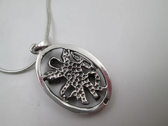 Cupid openwork oval pendant with cord. 925 sterling silver. Carabiner clasp. 1980's. Europe