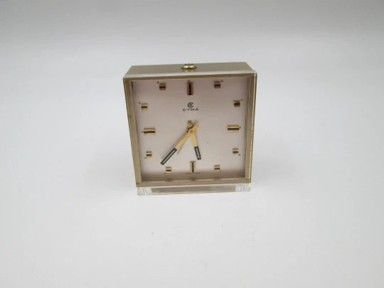 Cyma alarm table desk clock. Methacrylate front and bronze. Wind-up. Swiss. 1960's