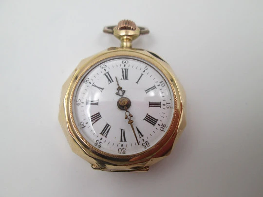 Decagonal pocket watch. 14k yellow gold. Stem-wind. Porcelain dial. Floral motifs. 1890