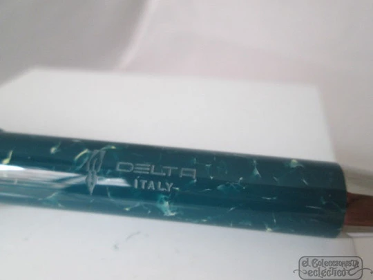 Delta. 2008. Italy. Box. Blue marble resin. 750 silver. Twist mechanism