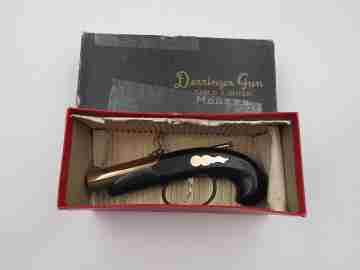 Deringer gun table lighter. Gold plated and black lacquer. Modern (Hirota & Co.). 1980's
