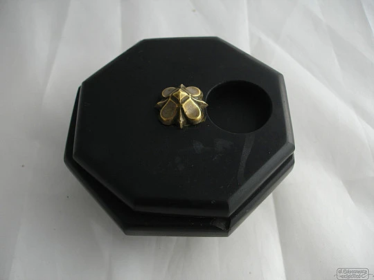 Desk inkwell. Black stone. Bronze flower. Octagonal shape