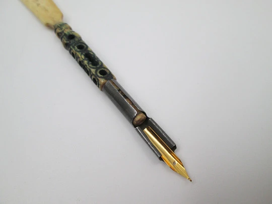 Dip calligraphy pen. Ivory and tinned metal. Geometric motifs. Europe. 1900