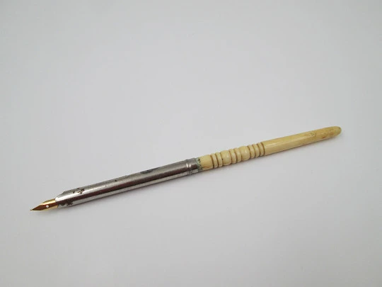 Dip calligraphy pen. Silver plated metal and ivory. Golden nib. Europe. 1900's