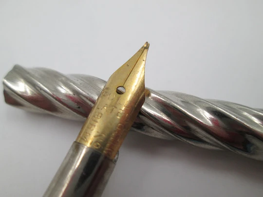 Dip calligraphy pen. Silver plated. Spiral design. Golden nib. Europe. 1900's