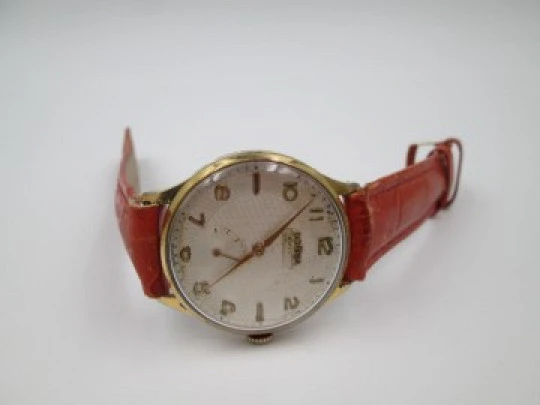 Dogma Prima. Gold plated & stainless steel. 1950's. Manual wind. Strap